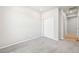 Clean bedroom features neutral paint, carpet floors, and a closet with sliding doors at 1957 S Coolidge Way, Aurora, CO 80018