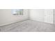 Bedroom with neutral carpet, light gray walls and double hung window at 1957 S Coolidge Way, Aurora, CO 80018