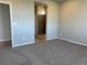 Spacious bedroom featuring plush carpeting and easy access to the ensuite bathroom at 1957 S Coolidge Way, Aurora, CO 80018