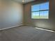 Cozy bedroom with comfortable carpet and a bright window view at 1957 S Coolidge Way, Aurora, CO 80018