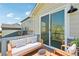 The comfortable deck features outdoor seating and a sliding glass door with views of the surrounding landscape at 1957 S Coolidge Way, Aurora, CO 80018