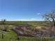 Scenic view of the golf course and surrounding landscape on a beautiful day at 1957 S Coolidge Way, Aurora, CO 80018