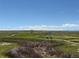 Scenic view of the golf course and surrounding landscape on a beautiful day at 1957 S Coolidge Way, Aurora, CO 80018