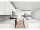 Modern kitchen featuring stainless steel appliances, center island, and hardwood floors at 1957 S Coolidge Way, Aurora, CO 80018