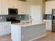 Beautiful kitchen featuring modern stainless appliances, granite countertops, and a center island at 1957 S Coolidge Way, Aurora, CO 80018