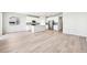 Open-concept area featuring a modern kitchen with stainless appliances and spacious living area at 1957 S Coolidge Way, Aurora, CO 80018
