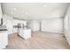 Spacious open-concept area with modern flooring and abundant natural light, perfect for entertaining at 1957 S Coolidge Way, Aurora, CO 80018