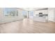 Bright living room featuring hardwood floors, and sliding glass door to backyard at 1957 S Coolidge Way, Aurora, CO 80018
