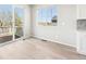 Bright room with large windows and sliding glass door leading to balcony at 1957 S Coolidge Way, Aurora, CO 80018