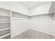 Walk-in closet equipped with shelves and rod for optimal storage at 1957 S Coolidge Way, Aurora, CO 80018