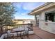 Back porch with seating area and stunning mountain views at 93 Glenmoor Dr, Cherry Hills Village, CO 80113