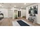 Home gym space featuring exercise equipment, neutral color palette, recessed lighting, and wood flooring at 93 Glenmoor Dr, Cherry Hills Village, CO 80113