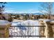 Exterior view showcasing mountain views from a stone terrace overlooking a golf course at 93 Glenmoor Dr, Cherry Hills Village, CO 80113