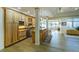 Open kitchen with wood cabinets, granite countertops, and a center island with barstool seating at 93 Glenmoor Dr, Cherry Hills Village, CO 80113