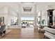 Bright living room featuring hardwood floors, ample natural light, and stylish furniture at 93 Glenmoor Dr, Cherry Hills Village, CO 80113
