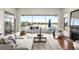 Comfortable living room with fireplace, patio access, and stunning views of the golf course at 93 Glenmoor Dr, Cherry Hills Village, CO 80113