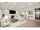 Bright living room features a modern fireplace, recessed lighting, and ample seating at 93 Glenmoor Dr, Cherry Hills Village, CO 80113