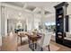 Open-concept living space with stylish furnishings, built-in shelving, and abundant natural light at 93 Glenmoor Dr, Cherry Hills Village, CO 80113