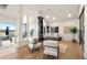 Bright home office space with built-in shelves, desk, and comfortable seating at 93 Glenmoor Dr, Cherry Hills Village, CO 80113