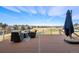 Outdoor patio with comfortable seating and expansive golf course and mountain views at 93 Glenmoor Dr, Cherry Hills Village, CO 80113