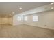 Spacious finished basement with neutral carpeting at 18455 W 94Th Ave, Arvada, CO 80007