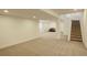 Finished basement area with stairs and sitting area at 18455 W 94Th Ave, Arvada, CO 80007