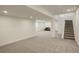 Finished basement with large open space and stairs at 18455 W 94Th Ave, Arvada, CO 80007