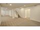 Finished basement with neutral carpeting and stairs at 18455 W 94Th Ave, Arvada, CO 80007