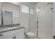 Bathroom with walk-in shower, granite countertop, and white cabinets at 18455 W 94Th Ave, Arvada, CO 80007