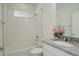 Clean bathroom with a shower/tub combo and granite vanity at 18455 W 94Th Ave, Arvada, CO 80007