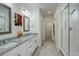 Bathroom with double vanity, granite countertop and shower at 18455 W 94Th Ave, Arvada, CO 80007