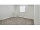 Simple bedroom with carpet flooring and window at 18455 W 94Th Ave, Arvada, CO 80007