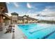 Relaxing community pool with lounge chairs and a clubhouse at 18455 W 94Th Ave, Arvada, CO 80007