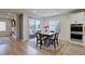 Bright dining area with a table and chairs, near kitchen and fireplace at 18455 W 94Th Ave, Arvada, CO 80007