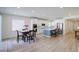 Open concept dining area with kitchen view, hardwood floor at 18455 W 94Th Ave, Arvada, CO 80007