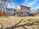 Spacious backyard featuring a covered patio perfect for outdoor relaxation and entertaining at 3706 E Easter Dr, Centennial, CO 80122