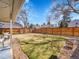 Large, private backyard with a mix of grass, and a spacious patio at 3706 E Easter Dr, Centennial, CO 80122