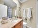 Well-lit bathroom with granite countertop, vanity, and neutral color scheme at 3706 E Easter Dr, Centennial, CO 80122