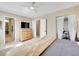 Inviting bedroom featuring a dresser, a large walk in closet and an adjacent office space at 3706 E Easter Dr, Centennial, CO 80122