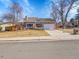 Well-maintained home with mature trees and a neatly kept lawn at 3706 E Easter Dr, Centennial, CO 80122