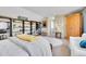 Comfortable main bedroom with unique decor, shelving, and bright natural light at 3706 E Easter Dr, Centennial, CO 80122