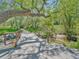 Scenic walking path through lush greenery and over a small stream at 3706 E Easter Dr, Centennial, CO 80122