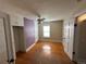 A sunny bedroom featuring hardwood floors, a ceiling fan, and built in closet at 1129 2Nd Ave, Longmont, CO 80501