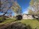 Single story house with ample greenery in the yard at 1129 2Nd Ave, Longmont, CO 80501