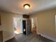 Bright kitchen with stainless steel refrigerator, hardwood floors and doorway leading to adjacent rooms at 1129 2Nd Ave, Longmont, CO 80501