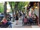 Charming street view featuring trees, outdoor lighting, and outdoor seating at a local bistro at 1129 2Nd Ave, Longmont, CO 80501