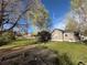 Spacious yard with grass, a garden, and a fenced-in home at 1129 2Nd Ave, Longmont, CO 80501