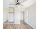 Bedroom with wood-look floors, ample closet space, and a neutral color palette at 4110 Hale Pkwy # 5F, Denver, CO 80220