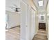 Hallway featuring closet, fan, and vanity with dark wood cabinets at 4110 Hale Pkwy # 5F, Denver, CO 80220