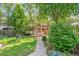 Large backyard with lush lawn and mature trees at 1827 N Bellaire St, Denver, CO 80220